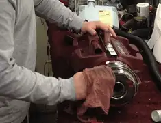 Vacuum repair technician cleaning and servicing a vacuum motor in Pasadena, CA